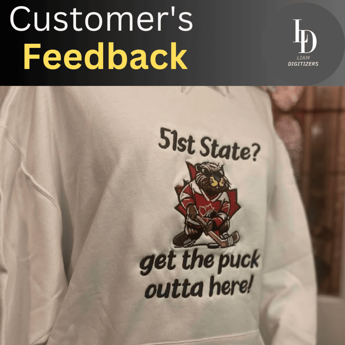 Embroidered beaver in hockey gear on a cream hoodie with the text 51st State? Get the puck outta here