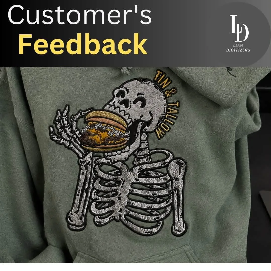 Embroidered skeleton eating a burger, stitched on a sage green hoodie